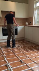 Efficient electric kitchen underfloor heating system for homes